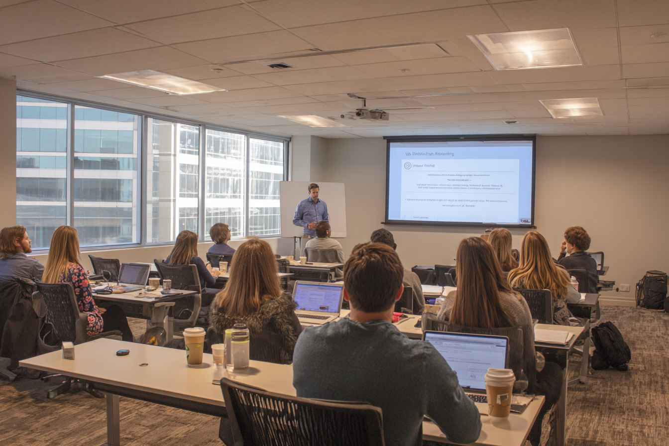HR trainer leading a workplace ethics and data-handling session for new hires.